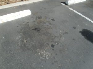 Initial Damage Caused by Oil Spots in the Asphalt